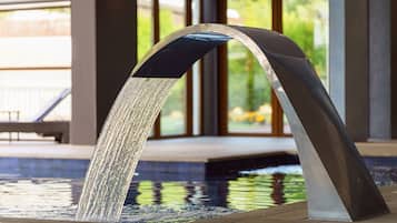 Indoor pool, open 7:00 AM to 10:00 PM, pool umbrellas, pool loungers