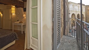 A balcony with a view of a historic building. - B&B Il Corso (Siena)
