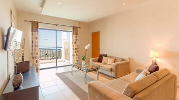 Panoramic Suite, 1 Bedroom | Living room | 22-inch LCD TV with satellite channels, TV