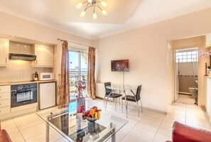 Standard Apartment, 1 Bedroom | Living area | 22-inch LCD TV with satellite channels, TV - Hill View Restaurant & Apartments (Pissouri)