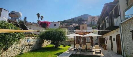 Outdoor pool, pool umbrellas, sun loungers