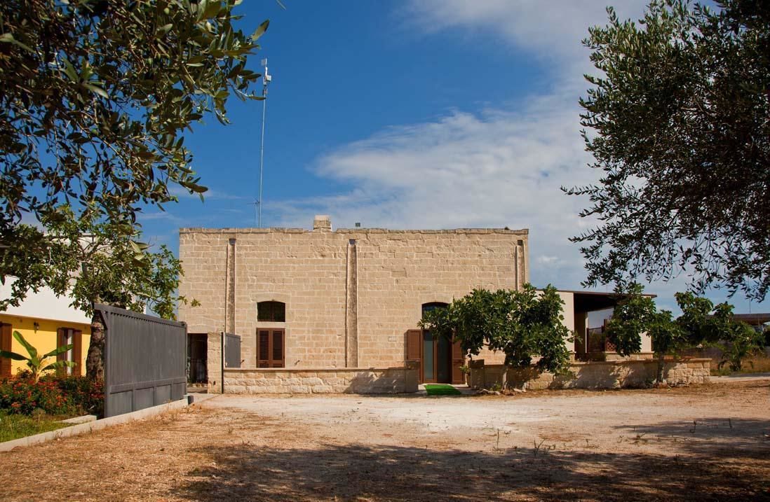A building with a simple, rectangular structure, a flat roof, and a small antenna on top.