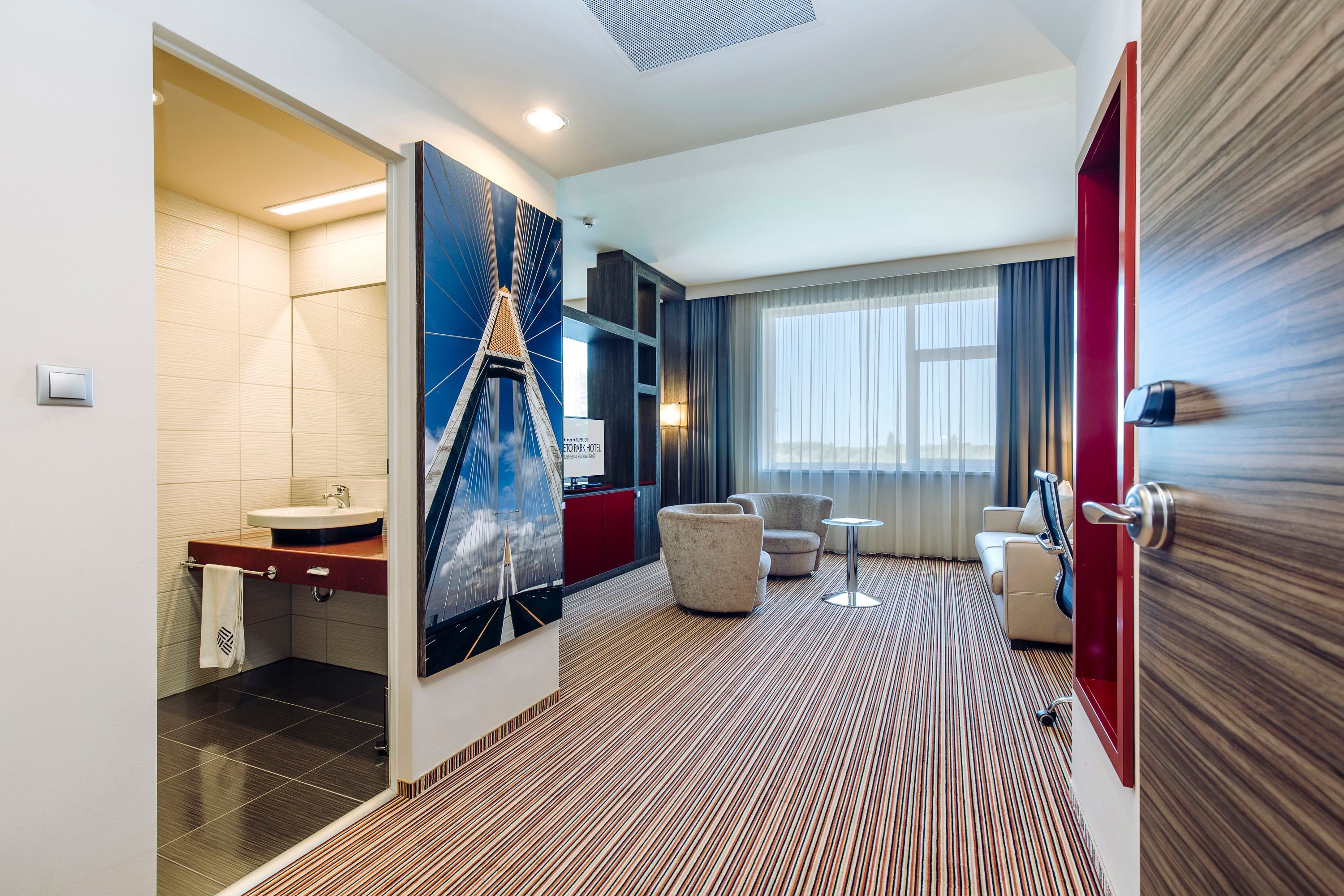 executive suite stadium view | minibar, in-room safe, desk, laptop workspace