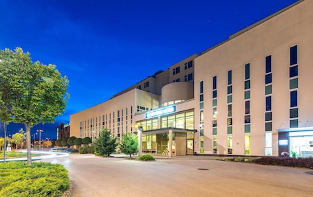 Front of property – evening/night. ETO Park Hotel Business & Stadium