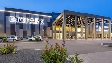 A modern building with a large illuminated sign reading 'PARK'.
