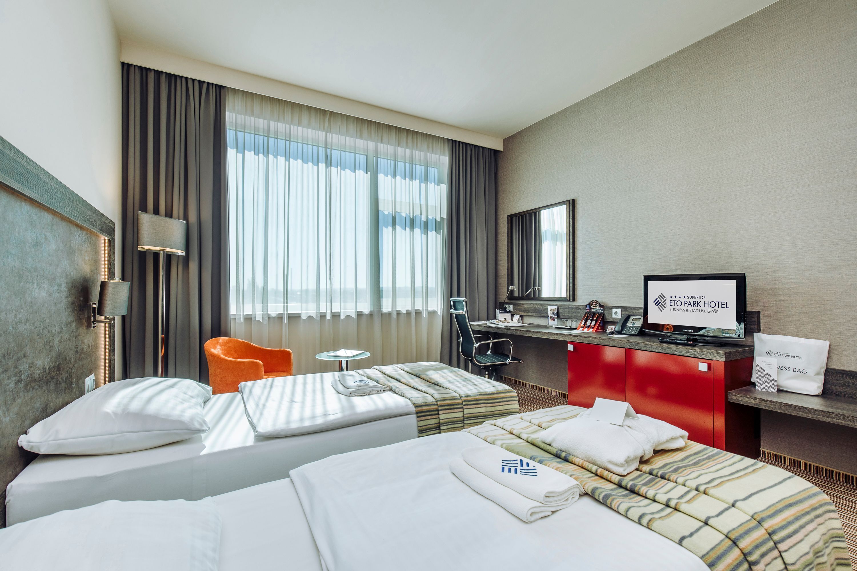 superior twin room (with stadium view) | minibar, in-room safe, desk, laptop workspace