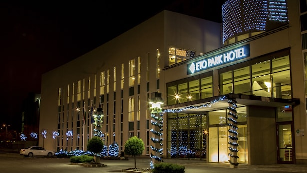 The exterior of the EFD Park Hotel with a modern design, featuring a prominent entrance and illuminated signage. - ETO Park Hotel Business & Stadium (Gyor)