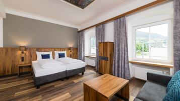 Comfort Quadruple Room | Minibar, in-room safe, individually decorated, desk