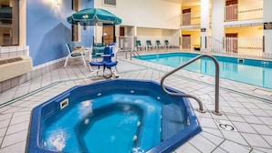 A hotel indoor pool area with a hot tub, lounge chairs, and a pool table. - Quality Inn Keystone near Mount Rushmore (Keystone)