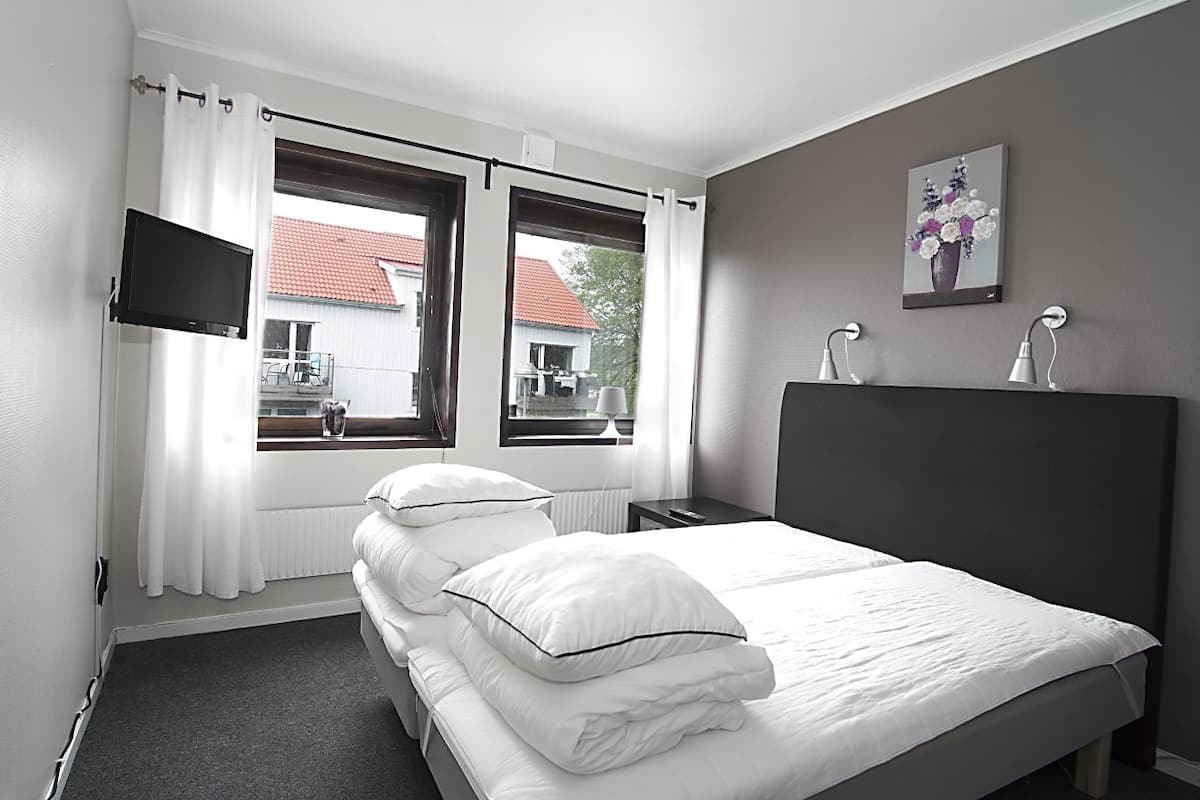 Desk, blackout drapes, WiFi (free), bed sheets