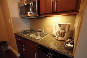 Fridge, microwave, stovetop, coffee/tea maker