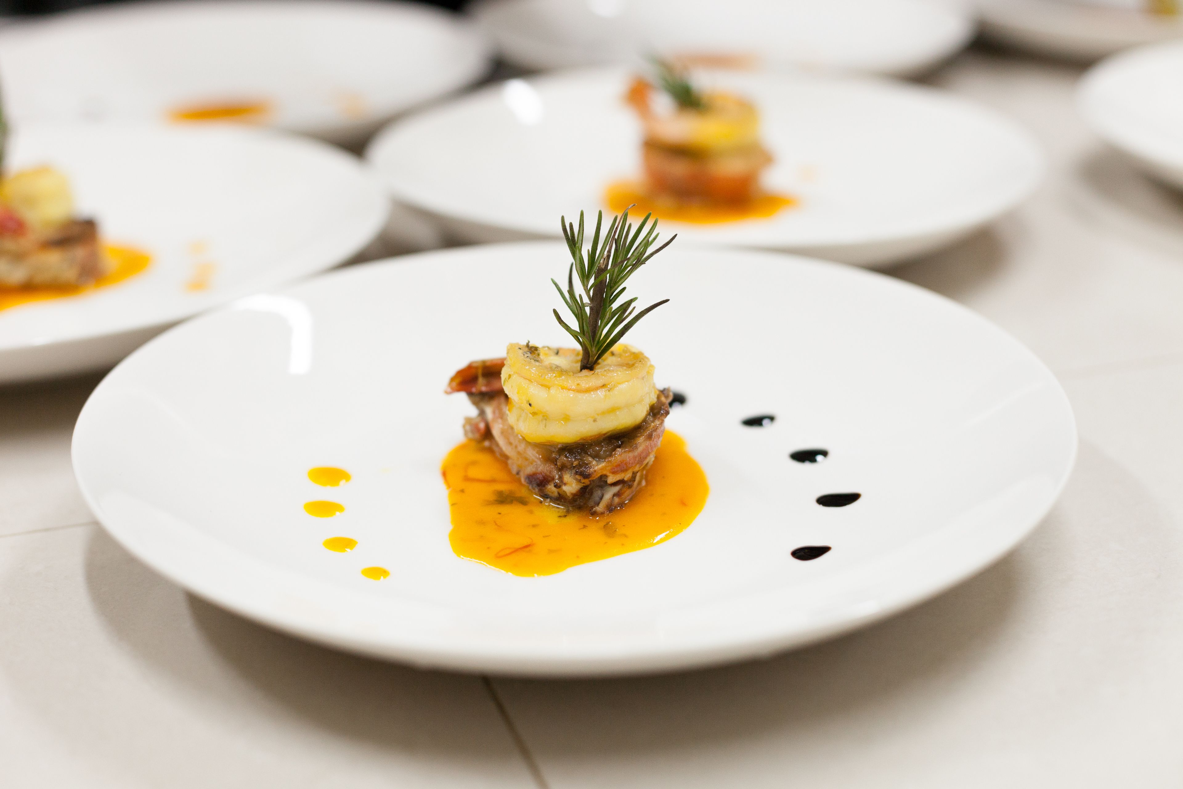 A plate of food with a garnish on top.
