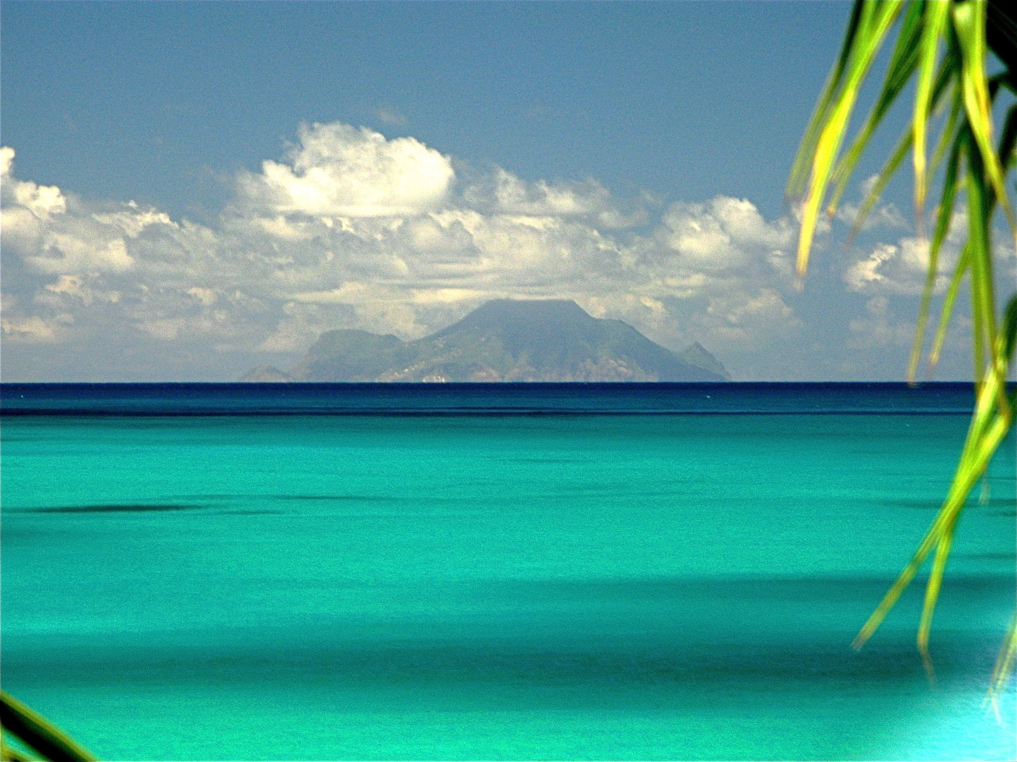 on the beach, sun-loungers, beach umbrellas, beach towels