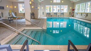 An indoor swimming pool with clear lanes, a lifeguard chair, and a sunroof. - Residence Inn Woodbridge Edison/Raritan Center (Woodbridge)