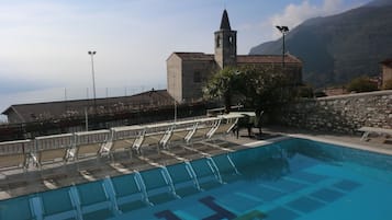 Seasonal outdoor pool, open 8:00 AM to 8:00 PM, pool umbrellas