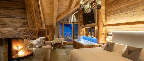 Suite monolocale Deluxe, caminetto (sauna) | Minibar, tende oscuranti, insonorizzazione, Wi-Fi gratuito