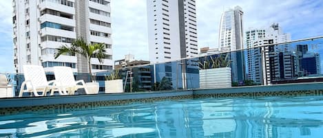 Outdoor pool, open 9:00 AM to 6:00 PM, sun loungers