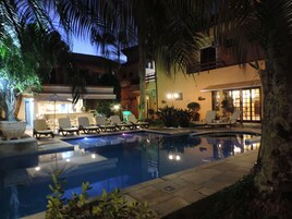 Indoor pool, outdoor pool, open 10 AM to 10 PM, pool umbrellas