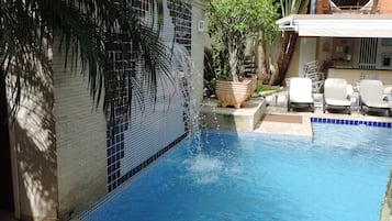 Indoor pool, outdoor pool, open 10 AM to 10 PM, pool umbrellas