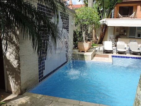 Indoor pool, outdoor pool, open 10 AM to 10 PM, pool umbrellas