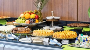A buffet with various food items including fruits, cakes, and pastries. - Villa Park Hotel Natal (Natal)
