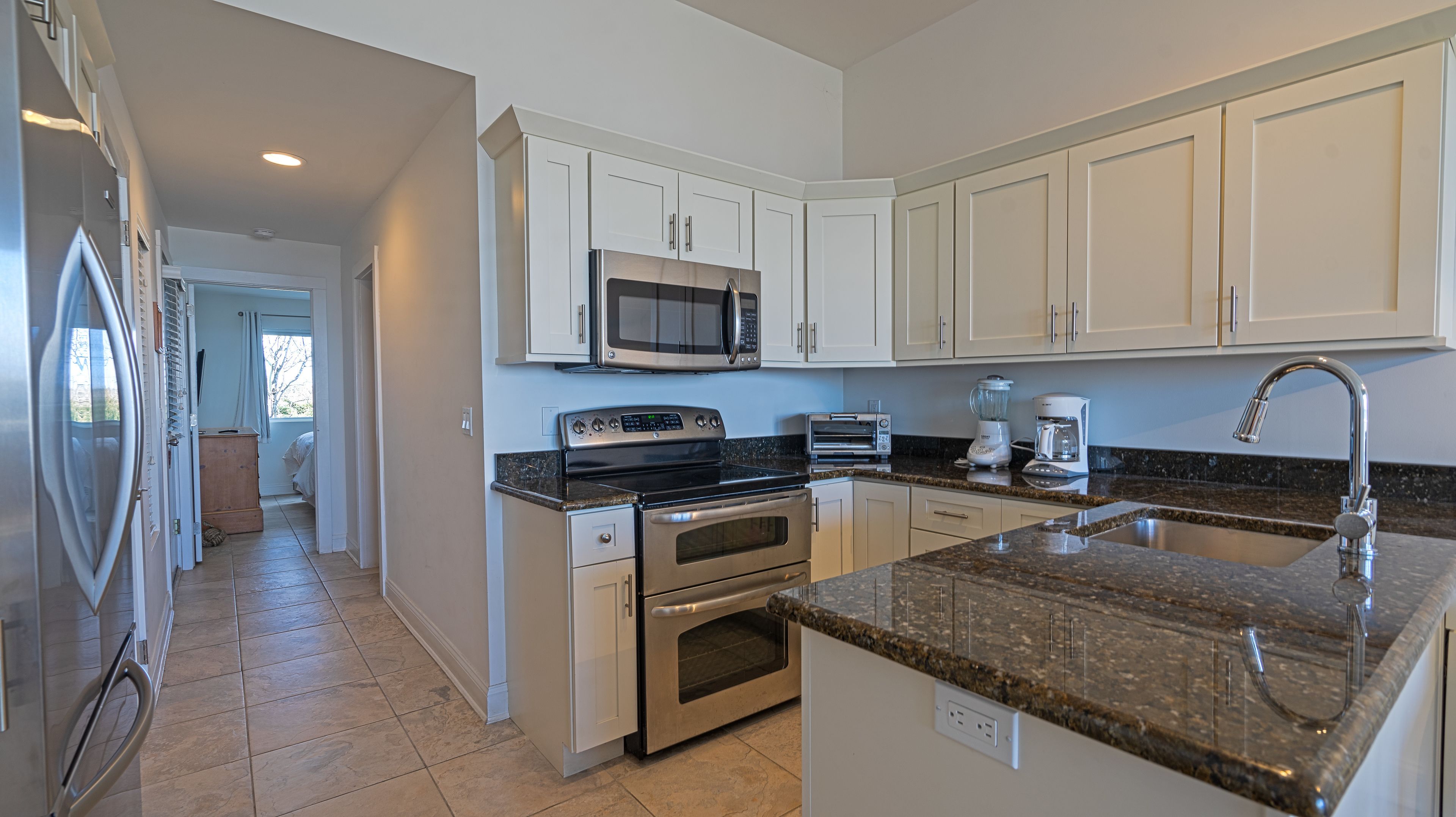 suite, 1 bedroom, kitchen, ocean view | private kitchen | full-sized fridge, microwave, stovetop, cookware/dishes/utensils