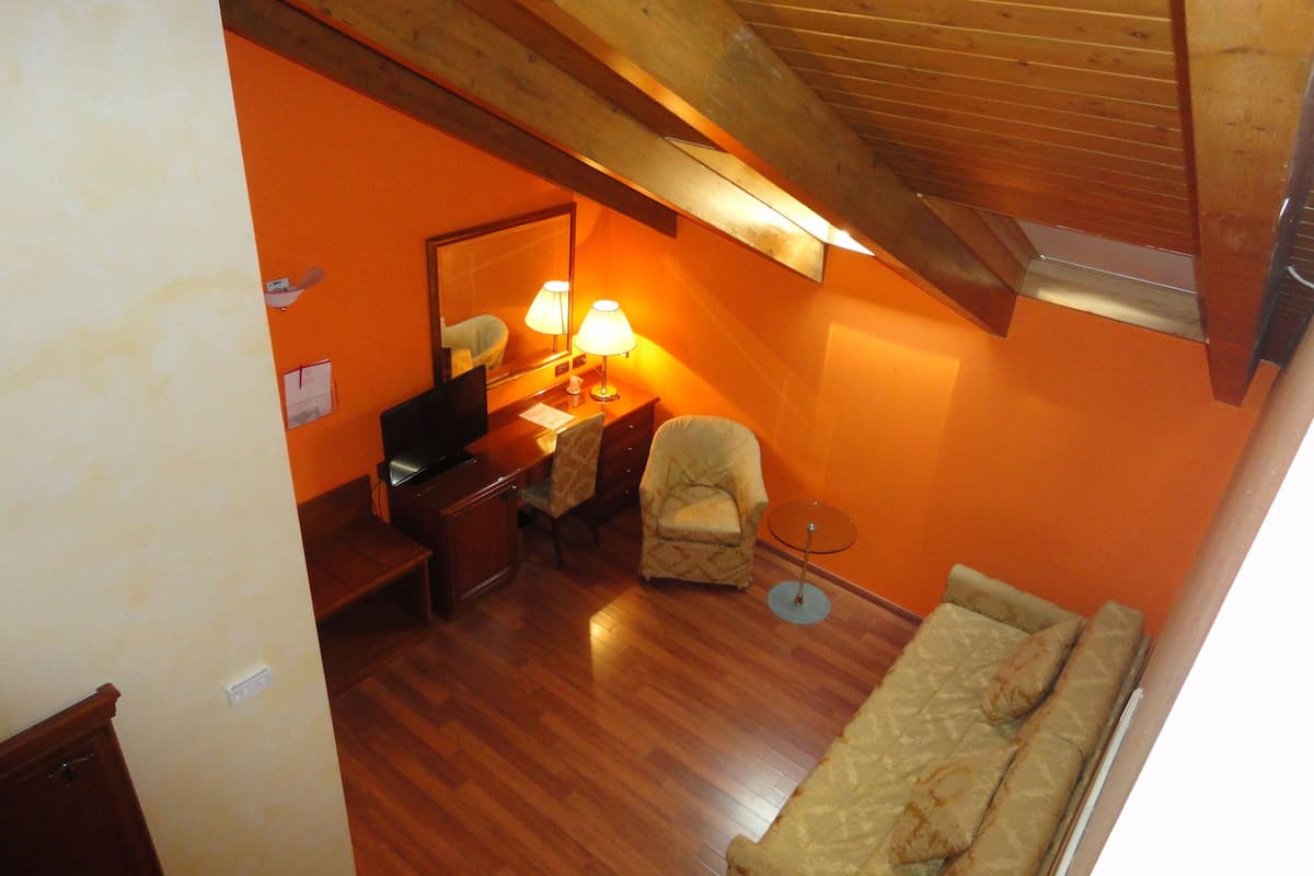 family room | in-room safe, desk, soundproofing, rollaway beds