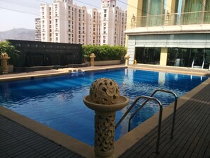 Outdoor pool, open 6 AM to 7:00 PM, sun loungers - Royal Tulip Navi Mumbai (Panvel)