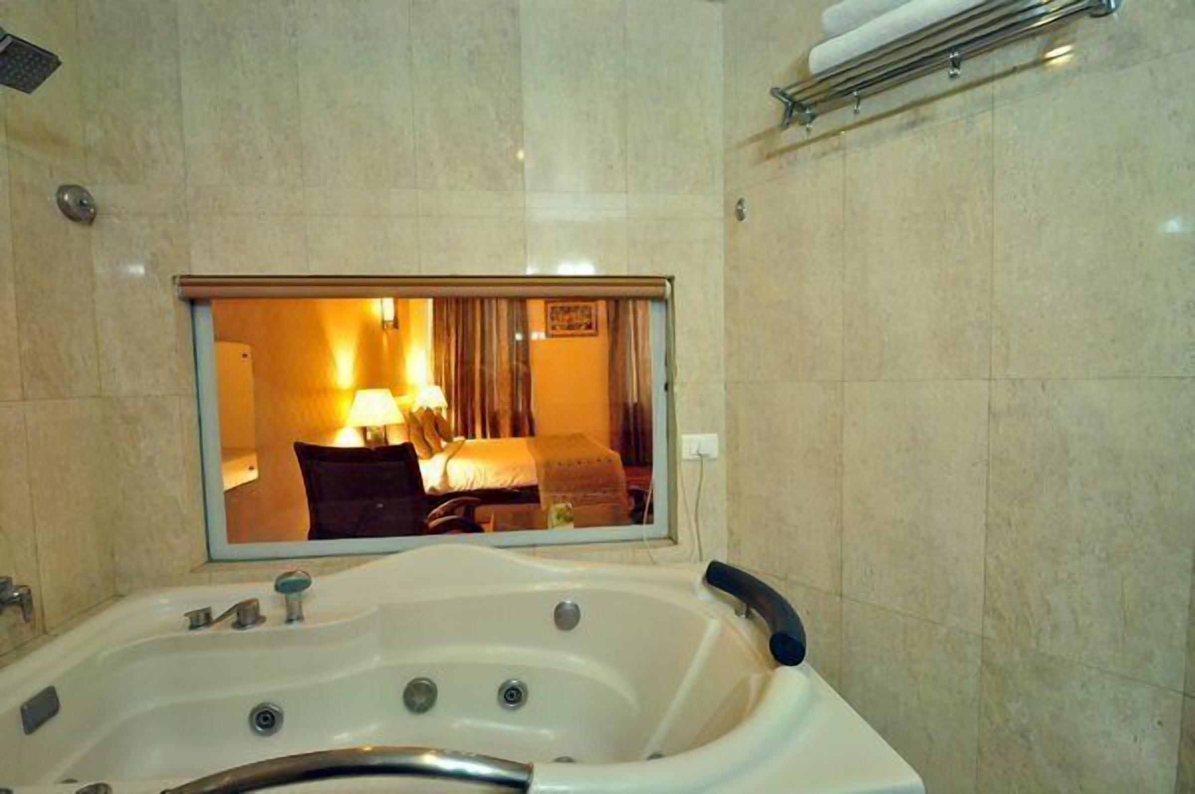 superior suite, 1 queen bed, smoking | bathroom | shower, free toiletries, hair dryer, slippers