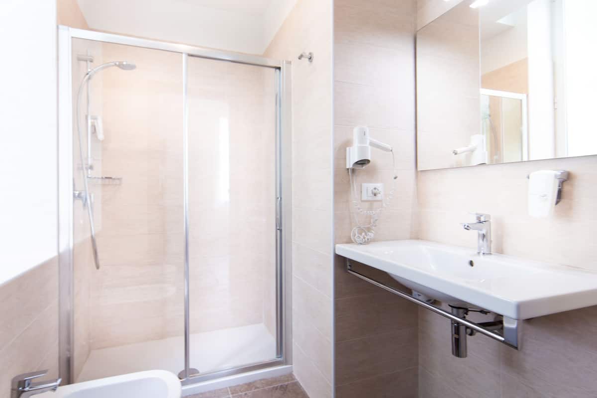 superior room, 1 queen bed, non smoking | bathroom | shower, rainfall showerhead, eco-friendly toiletries, hair dryer