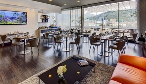 Breakfast, lunch served; international cuisine, al fresco dining 