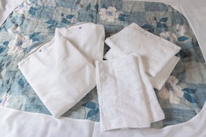 Combined shower/tub, free toiletries, hair dryer, slippers