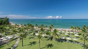 A resort with a beach view, palm trees, and sun loungers. - The Sands Khao Lak by Katathani (Takua Pa)