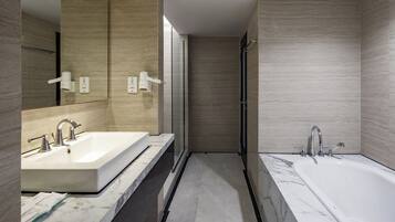 Santika Suite Room | Bathroom | Shower, slippers, towels