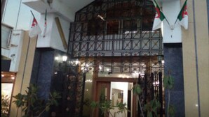 The exterior of El Biar Hotel with its name displayed prominently above the entrance. - El Biar Hotel (Algiers)
