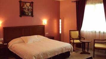 Habitación doble Deluxe | Minibar, cortinas blackout, insonorización y wifi gratis