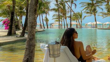 Outdoor pool, open 8:00 AM to 6:00 PM, pool umbrellas, sun loungers