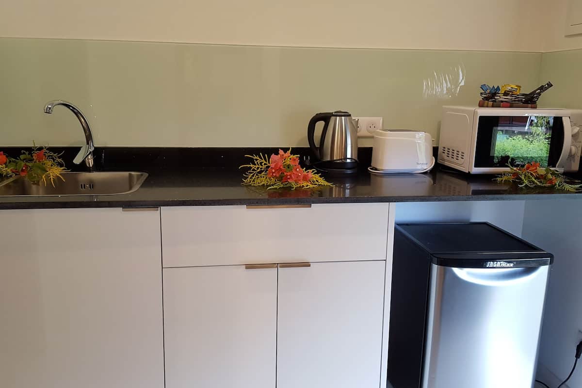 oven, coffee/tea maker, electric kettle, cookware/dishes/utensils