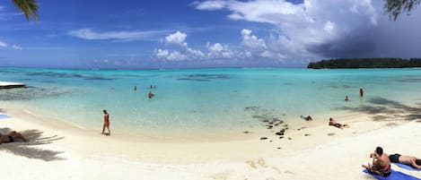 On the beach, white sand, beach towels, snorkeling