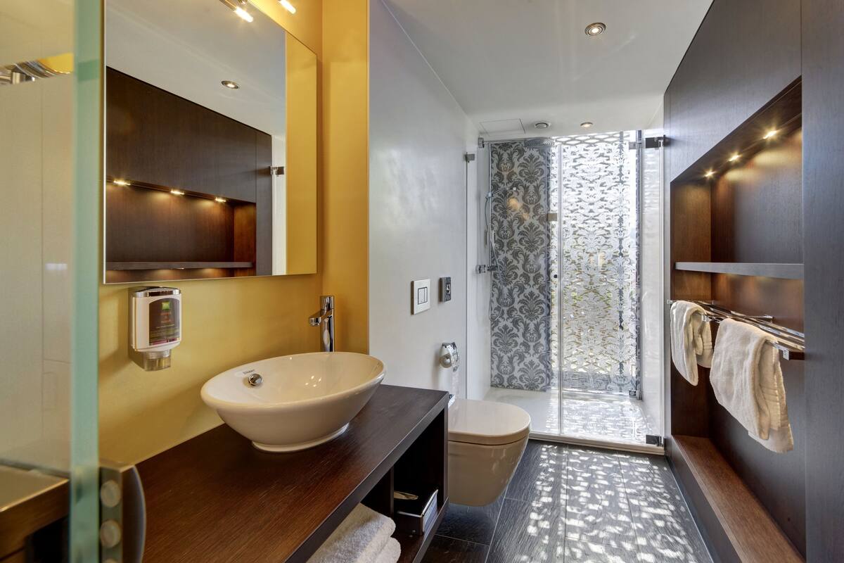 family suite (stylish),1 double bed and 2 twin beds) | bathroom | shower, eco-friendly toiletries, hair dryer, bathrobes