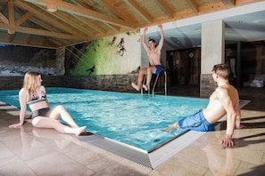 Indoor pool, seasonal outdoor pool, pool umbrellas, pool loungers