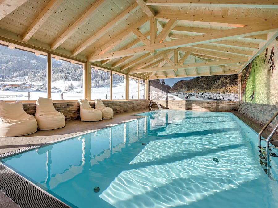 Indoor pool, seasonal outdoor pool, pool umbrellas, pool loungers