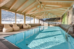 Indoor pool, seasonal outdoor pool, pool umbrellas, pool loungers
