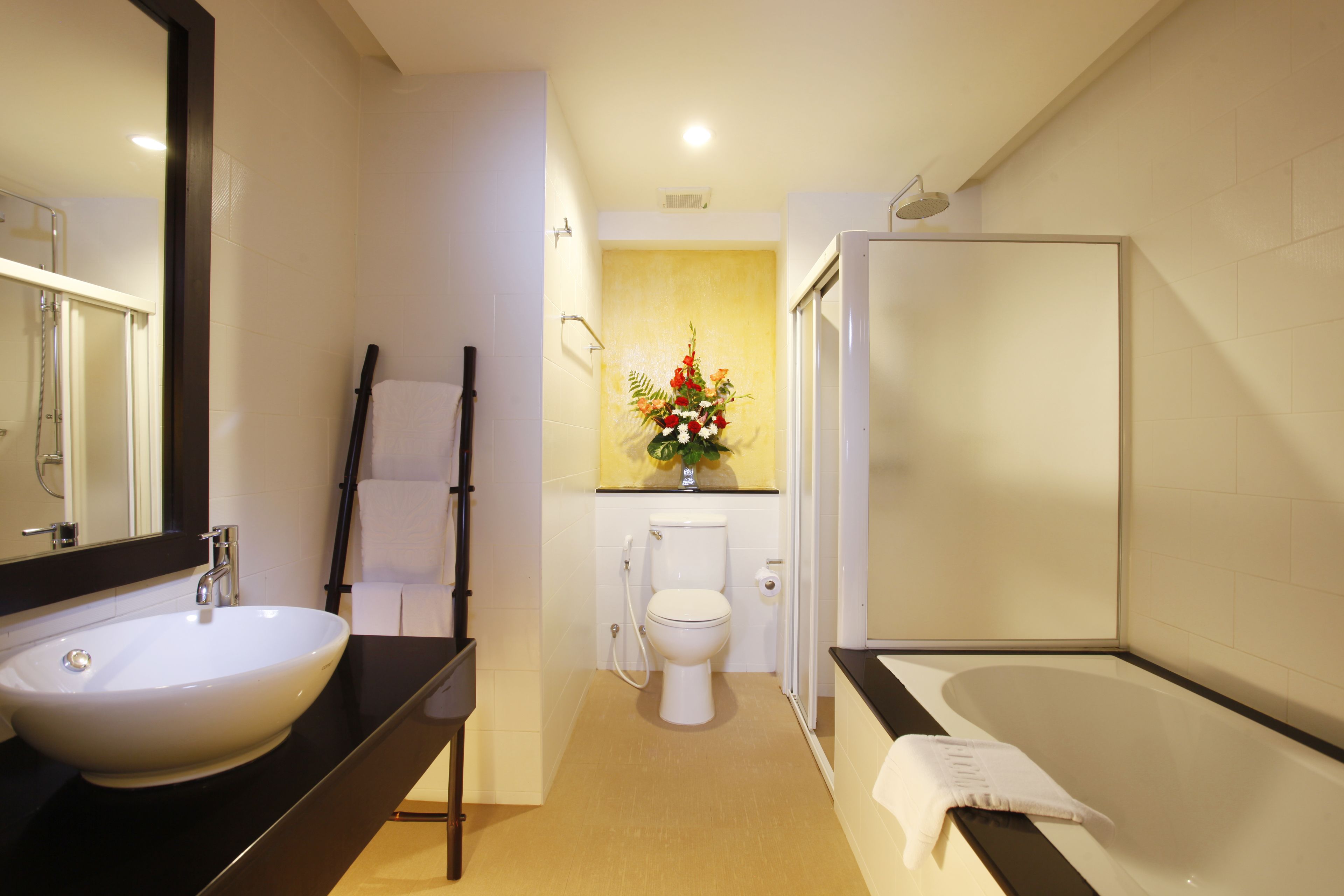 grand deluxe room pool view | bathroom | free toiletries, hair dryer, towels