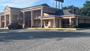 A two-story motel with a flat roof and a large billboard on top. - Motel 6 – Spindale, NC – Forest City (Spindale)