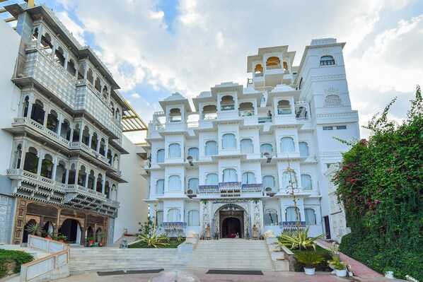 Experience the grandeur of this historic building, featuring ornate balconies and a beautifully maintained garden.