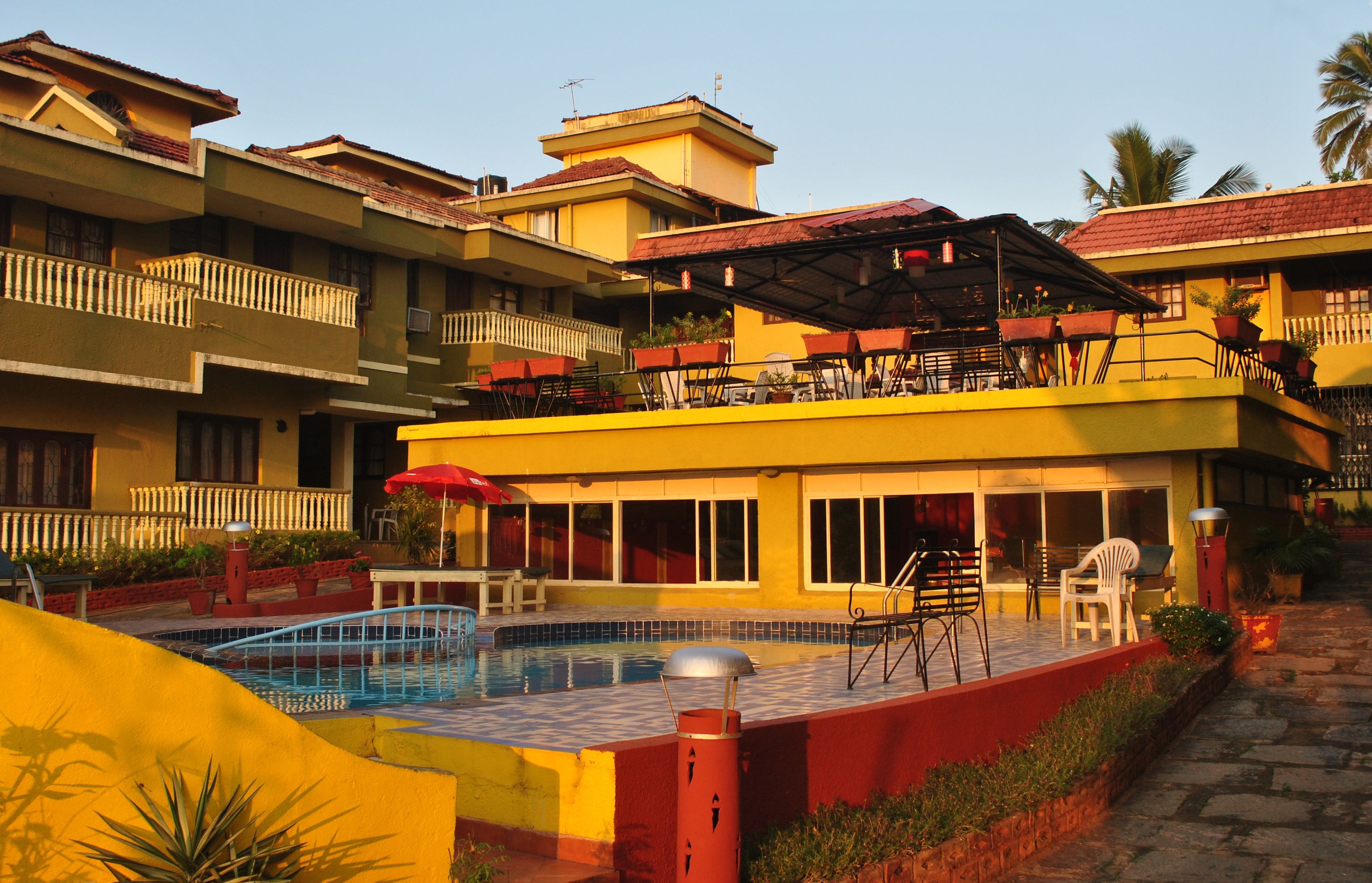 Outdoor pool, pool umbrellas. San Joao Holiday Homes