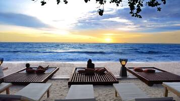 On the beach, sun loungers, beach umbrellas, beach towels