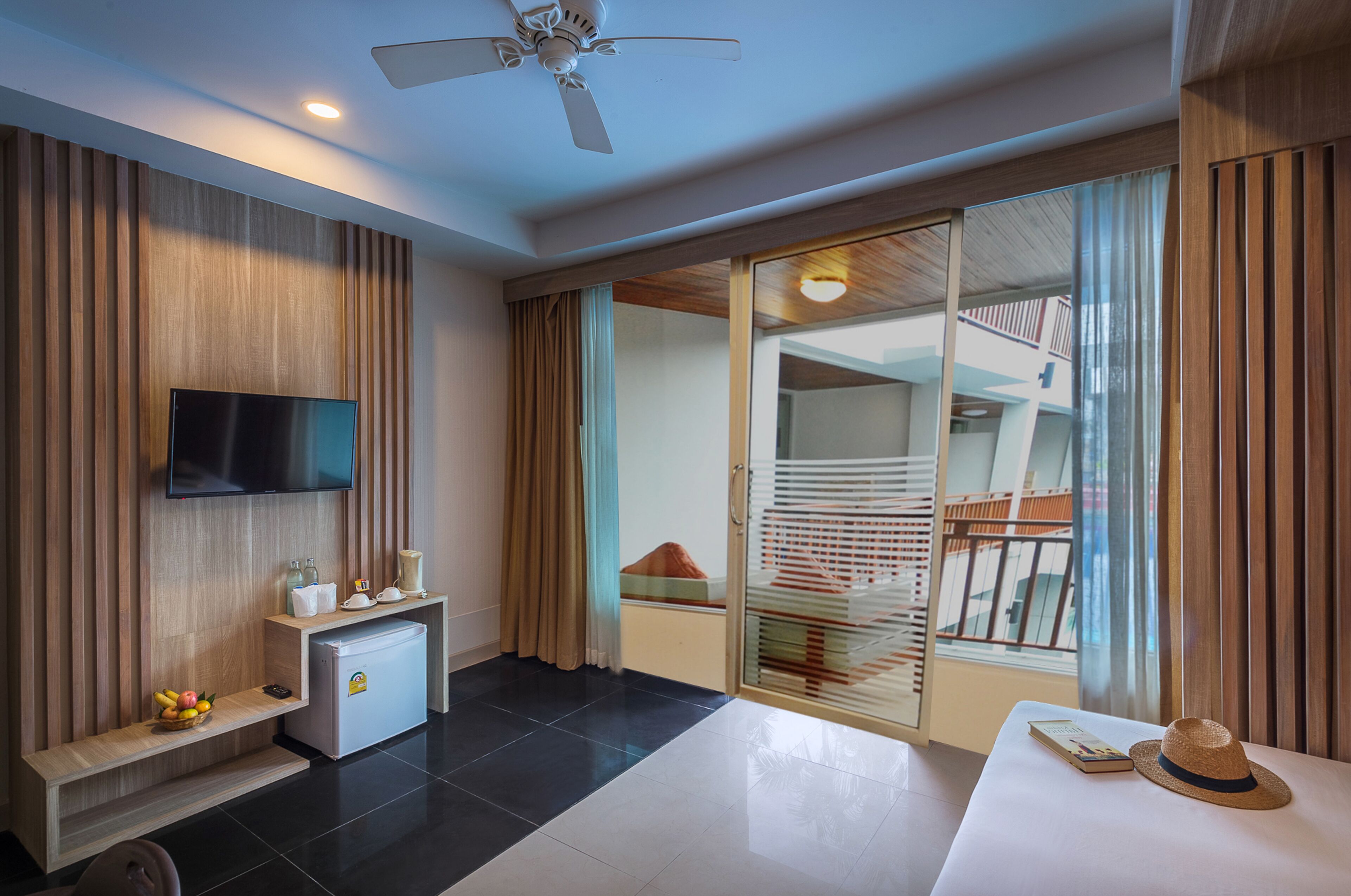 deluxe room, balcony | living area | 32-inch led tv with satellite channels