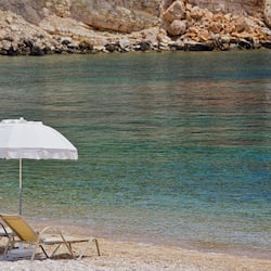 On the beach, sun-loungers, beach umbrellas, beach towels